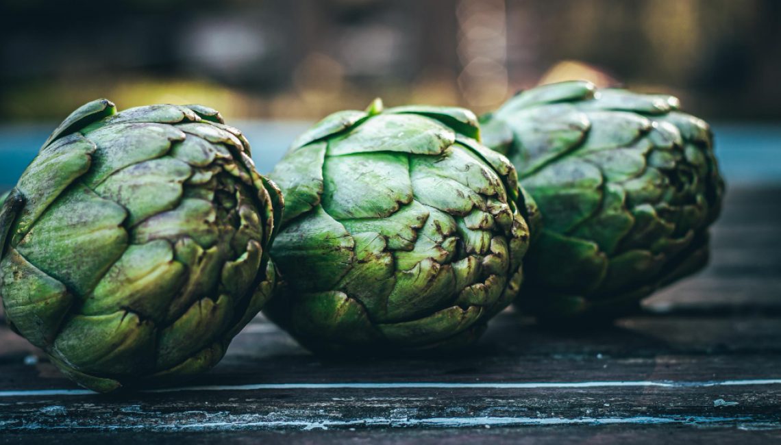 several-fresh-artichokes-on-the-table